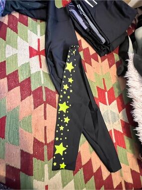ultracor Black Leggings with Neon Yellow Star Print NWT size L